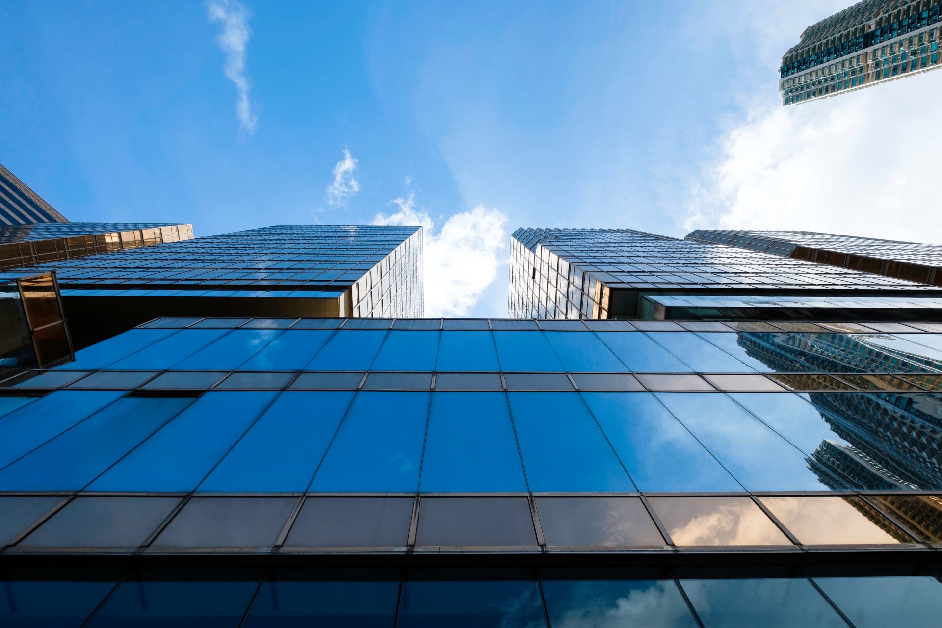 reflective-blue-glass-facade-modern-skyscraper-off-2025-03-25-13-42-49-utc